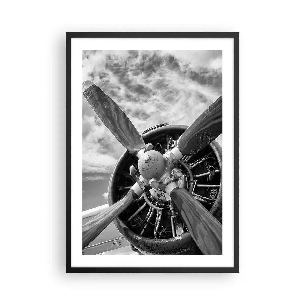 Poster in black frame - A black and white photograph of an airplane propeller against the sky. - 50x70cm - Conquerer of the Skies - Modern wall decoration for the living room and bedroom ARTTOR