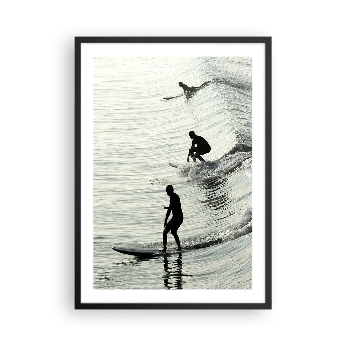 Poster in black frame - Three surfers riding the waves in a monochromatic style - 50x70cm - Meeting the Wave - Modern wall decoration for the living room and bedroom ARTTOR