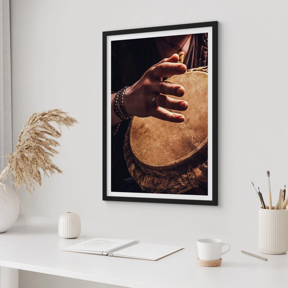 Poster in black frame - A hand playing a drum in warm light - 50x70cm - In the Rhythm of the Heart - Modern wall decoration for the living room and bedroom ARTTOR