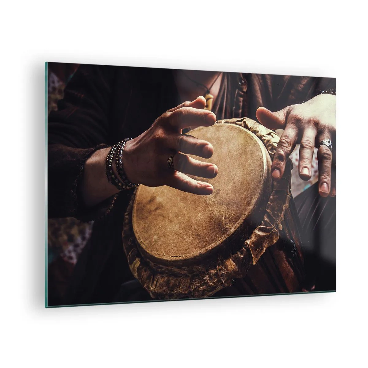 Glass picture - Close-up of hands playing a djembe drum in warm light. - 70x50cm - In the Rhythm of the Heart - Modern wall decoration for the living room and bedroom ARTTOR