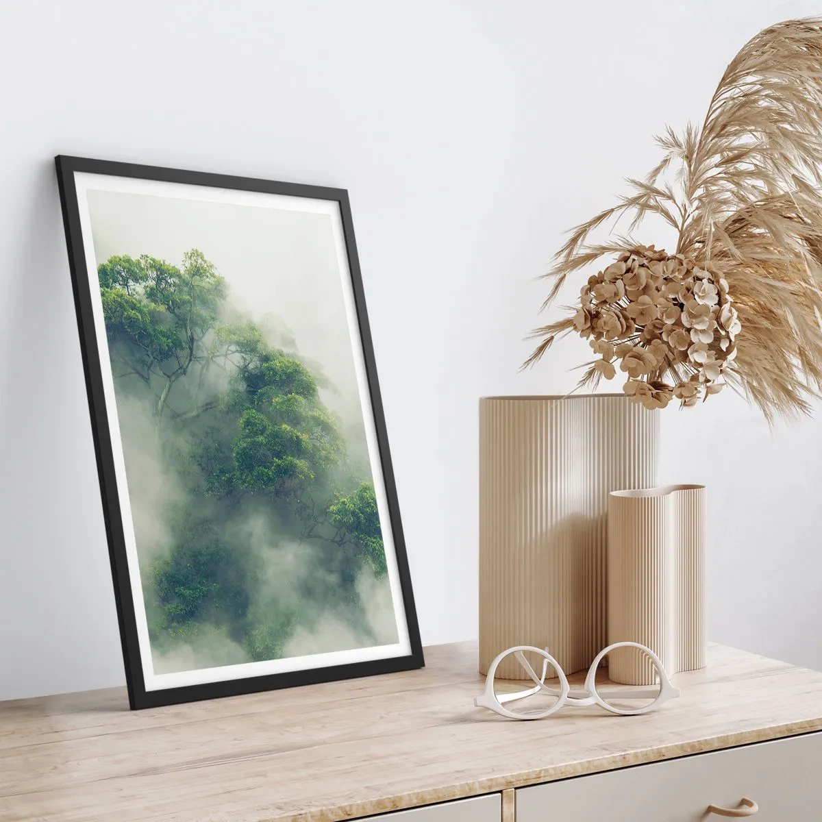 Poster in black frame - Green treetops hidden in thick, mysterious fog - 50x70cm - Wrapped In Fog - Modern wall decoration for the living room and bedroom ARTTOR