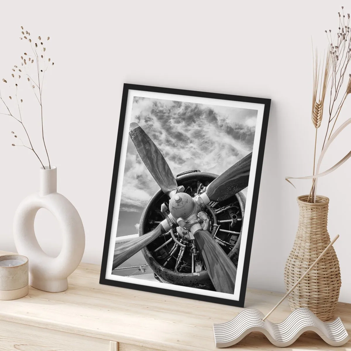 Poster in black frame - A black and white photograph of an airplane propeller against the sky. - 50x70cm - Conquerer of the Skies - Modern wall decoration for the living room and bedroom ARTTOR