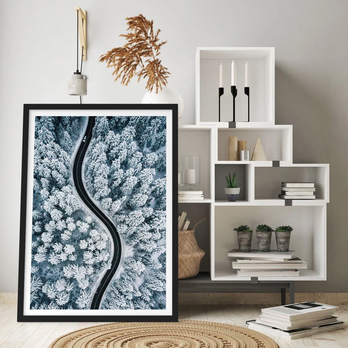 Poster in black frame - A picturesque road among snow-covered trees from a bird's eye view - 50x70cm - Through Wintery Forest - Modern wall decoration for the living room and bedroom ARTTOR