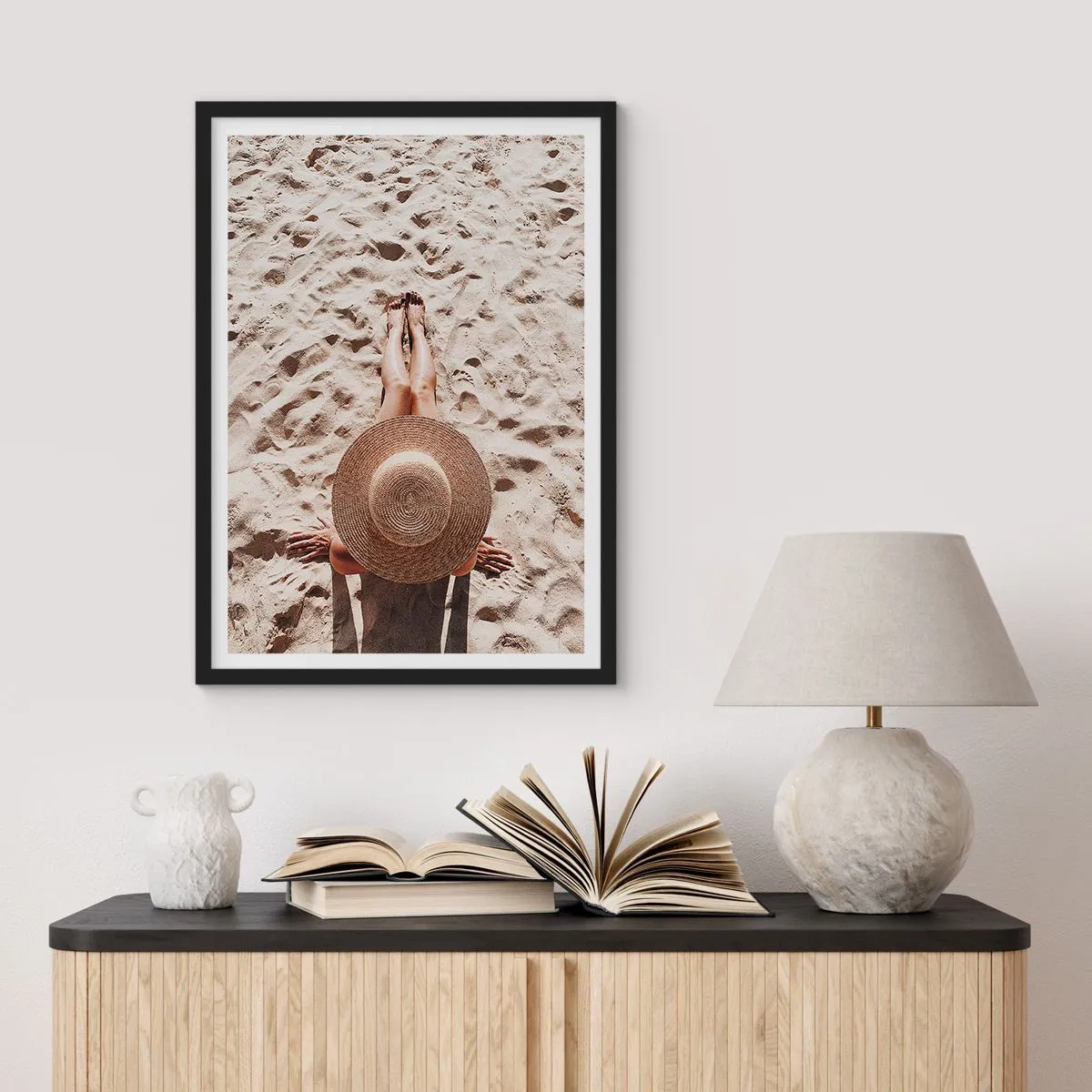 Poster in black frame - Person sunbathing on the beach, top view with a large hat against the sand - 50x70cm - Dream Time - Modern wall decoration for the living room and bedroom ARTTOR