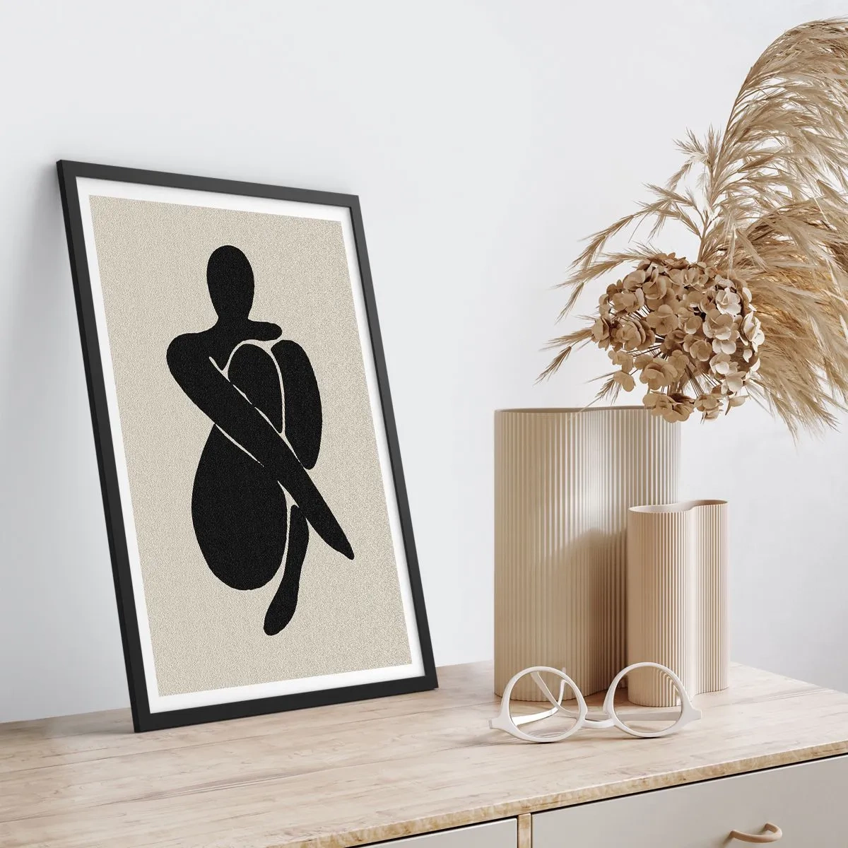 Poster in black frame - Abstract figure in a pose with arms wrapped around the body, black and white illustration - 50x70cm - In Her Own Arms - Modern wall decoration for the living room and bedroom ARTTOR