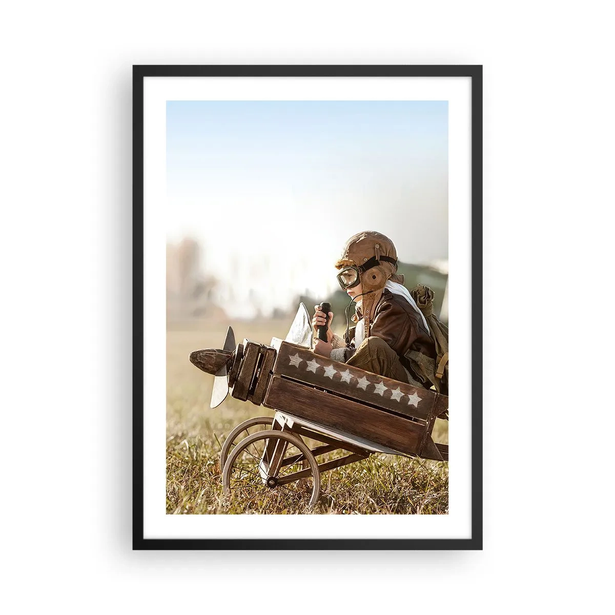 Poster in black frame - A child in a wooden airplane with stars in the background - 50x70cm - Take off for a Dream - Modern wall decoration for the living room and bedroom ARTTOR