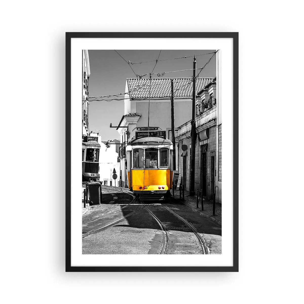 Poster in black frame - A yellow tram on the city streets in a black and white setting - 50x70cm - Spirit of Lisbon - Modern wall decoration for the living room and bedroom ARTTOR